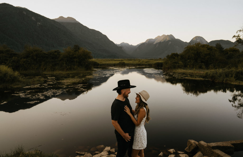 couple with lake reflexion in pitt meadows