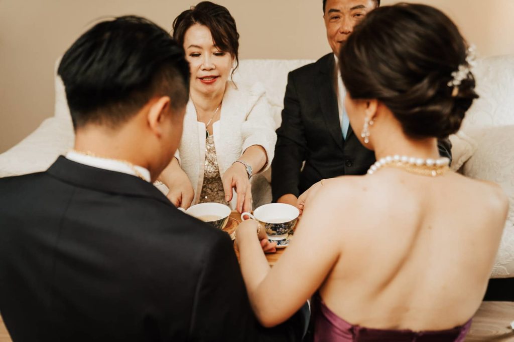Bride giving tea parents tea ceremony vancouver