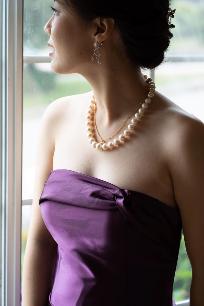 Bride waiting his groom tea ceremony bride is looking over a window