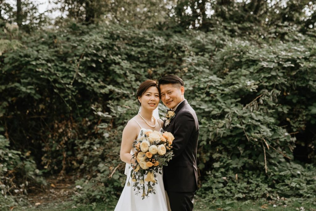 Couple smiling after getting married photos session in vancouver park