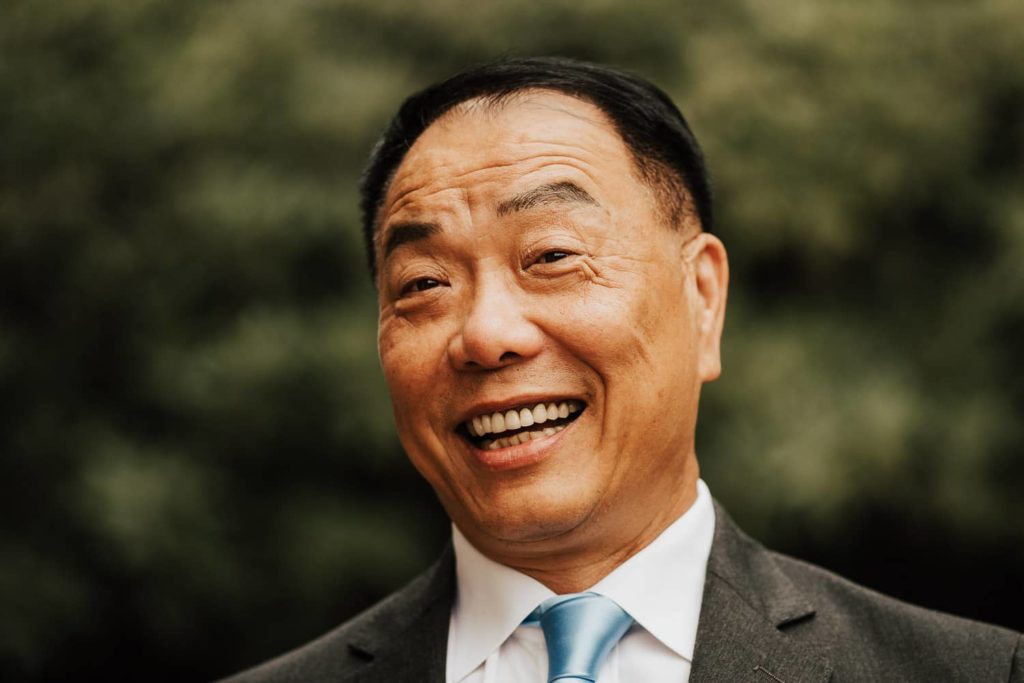 Dad laughing tea ceremony portrait close up