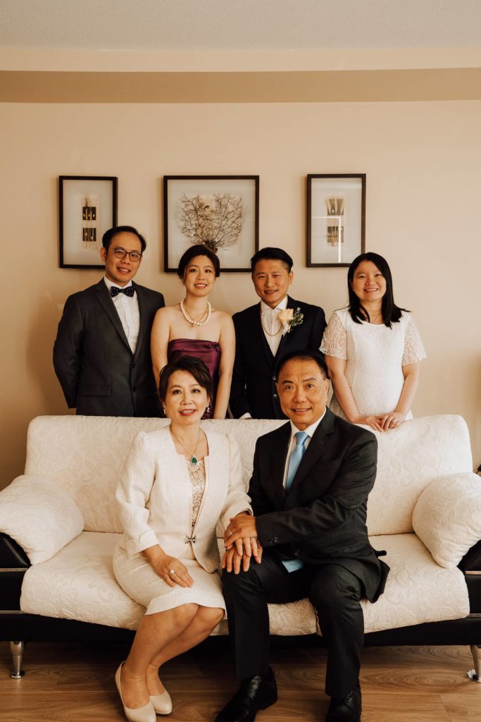 Family portrait during tea ceremony parents couple siblings