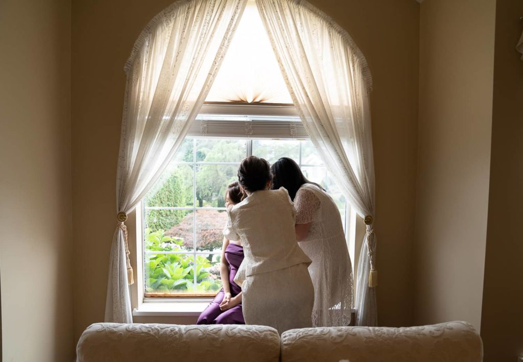 Getting Ready Picture Tea Ceremony Vancouver. Mom adjusting bride's dress