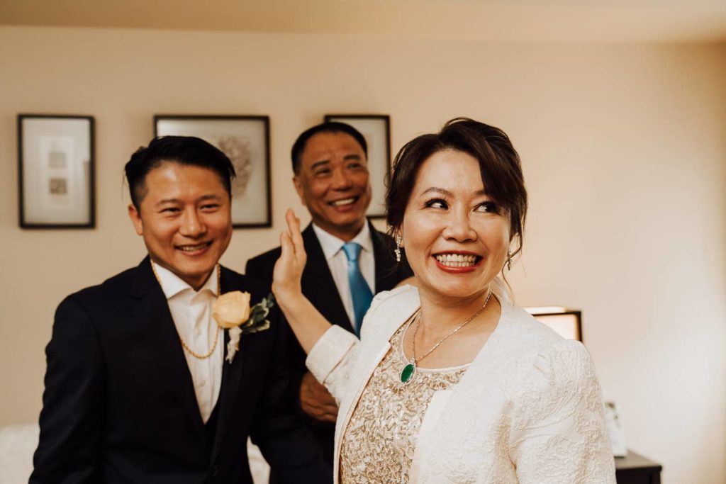 Groom mother in law laughing tea ceremony