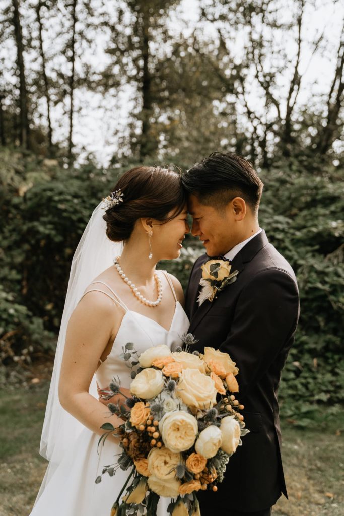 bride groom hugging in forest at surrey.jpg
